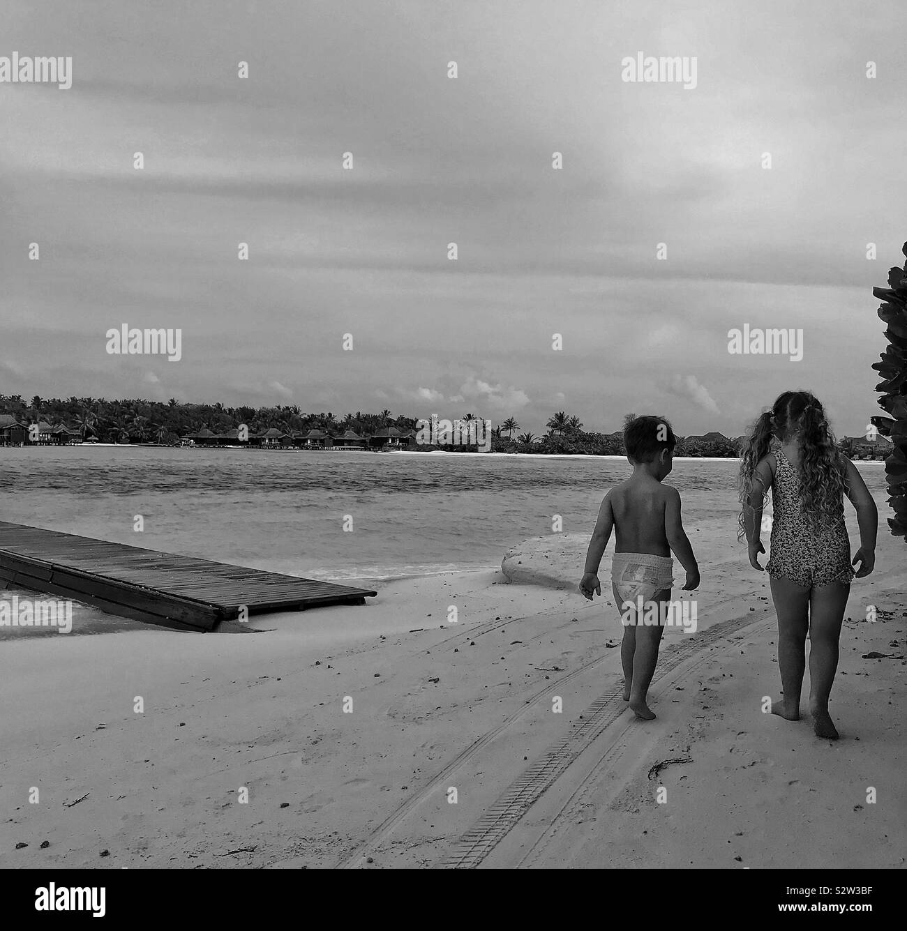 Children walking on the beach Stock Photo - Alamy