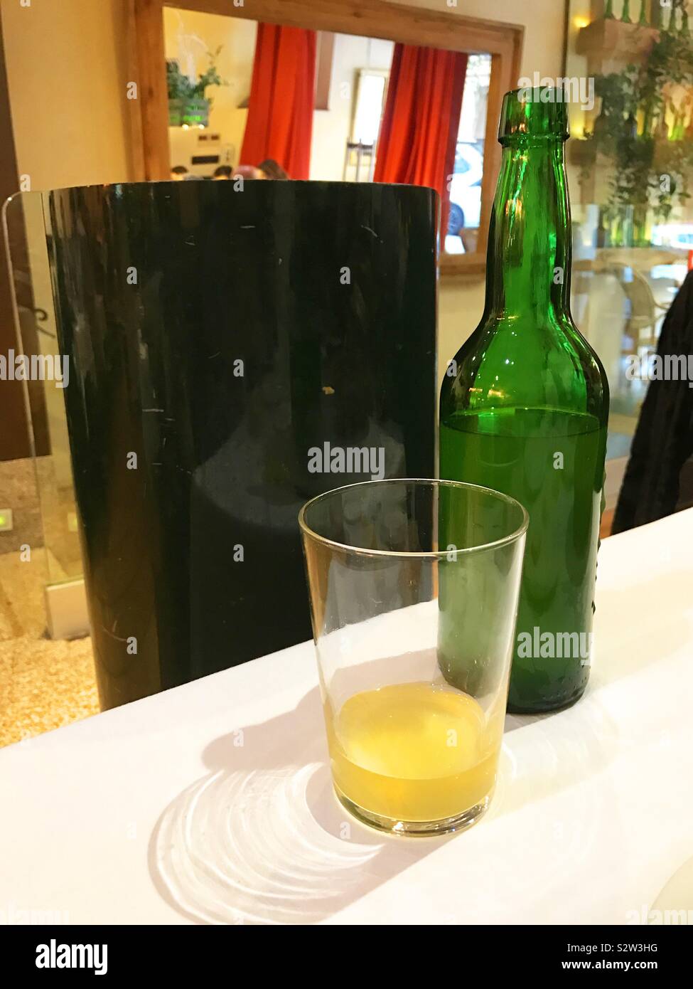 Glass and bottle of cider. Asturias, Spain. - Smartphone Captured Stock Image