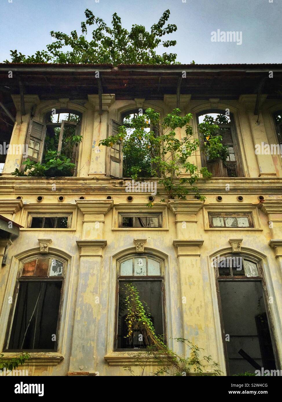 Detail of the façade of the derelict Goh Chan Lau ('Five-Storey Bungalow'), built in the late 19th century and formerly the Shih Chung Branch School, George Town, Penang, Malaysia - Smartphone Captured Stock Image