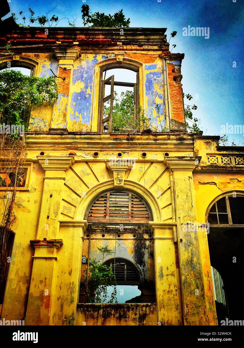 Detail of the façade of the derelict Goh Chan Lau ('Five-Storey Bungalow'), built in the late 19th century and formerly the Shih Chung Branch School, George Town, Penang, Malaysia - Smartphone Captured Stock Image