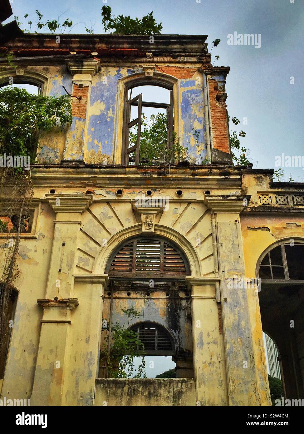 Detail of the façade of the derelict Goh Chan Lau ('Five-Storey Bungalow'), built in the late 19th century and formerly the Shih Chung Branch School, George Town, Penang, Malaysia - Smartphone Captured Stock Image