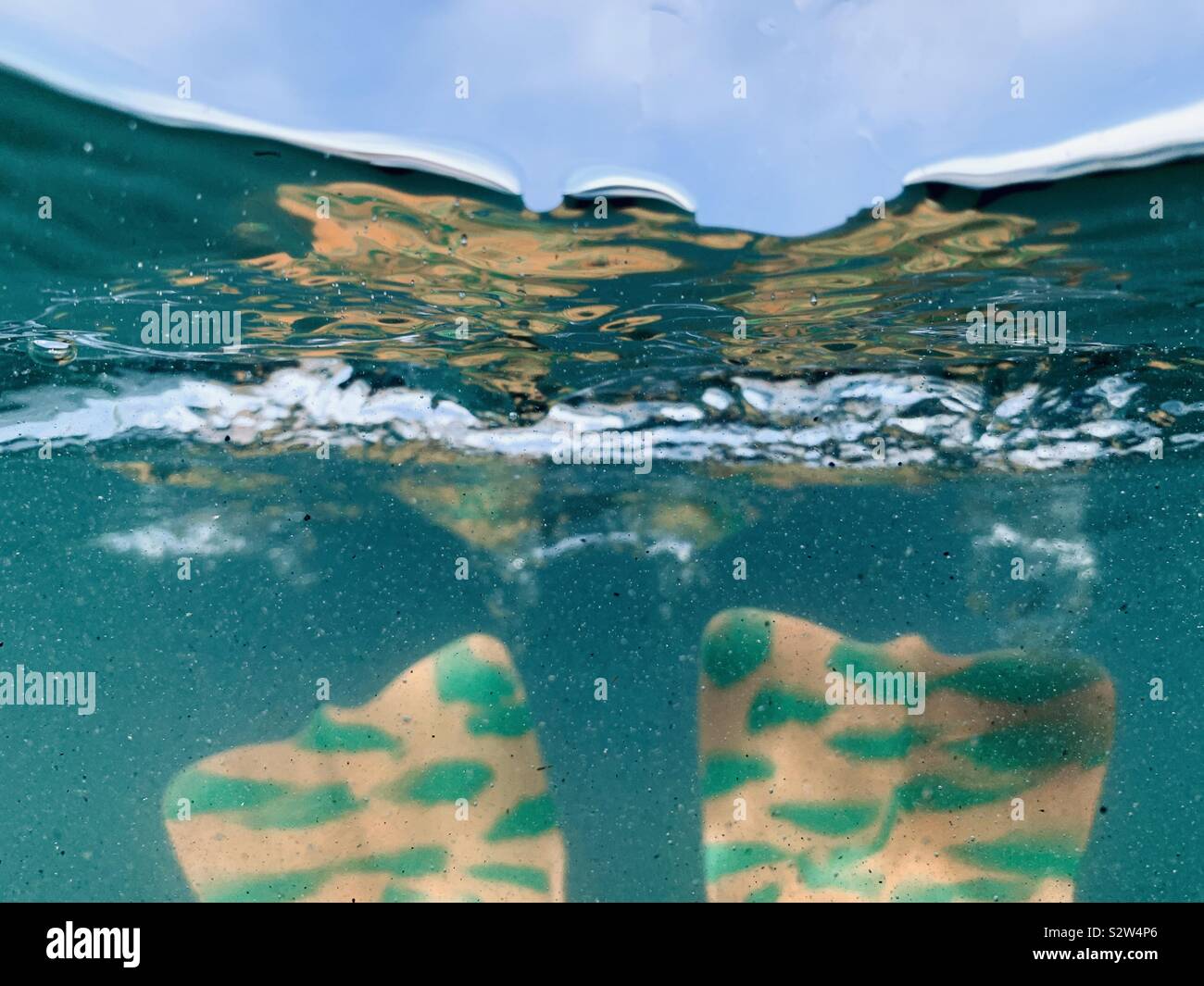 Bodysurfing swim fins underwater. Stock Photo