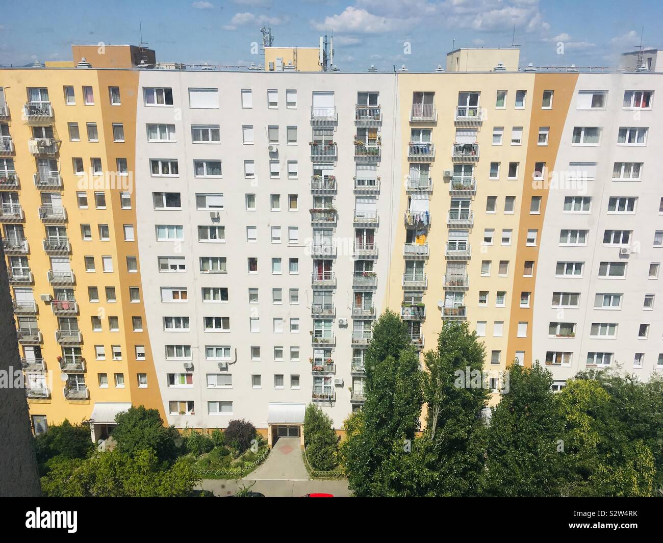 Recently insulated ten-story block building seen from top of neighbouring block in Budapest, Hungary - Smartphone Captured Stock Image