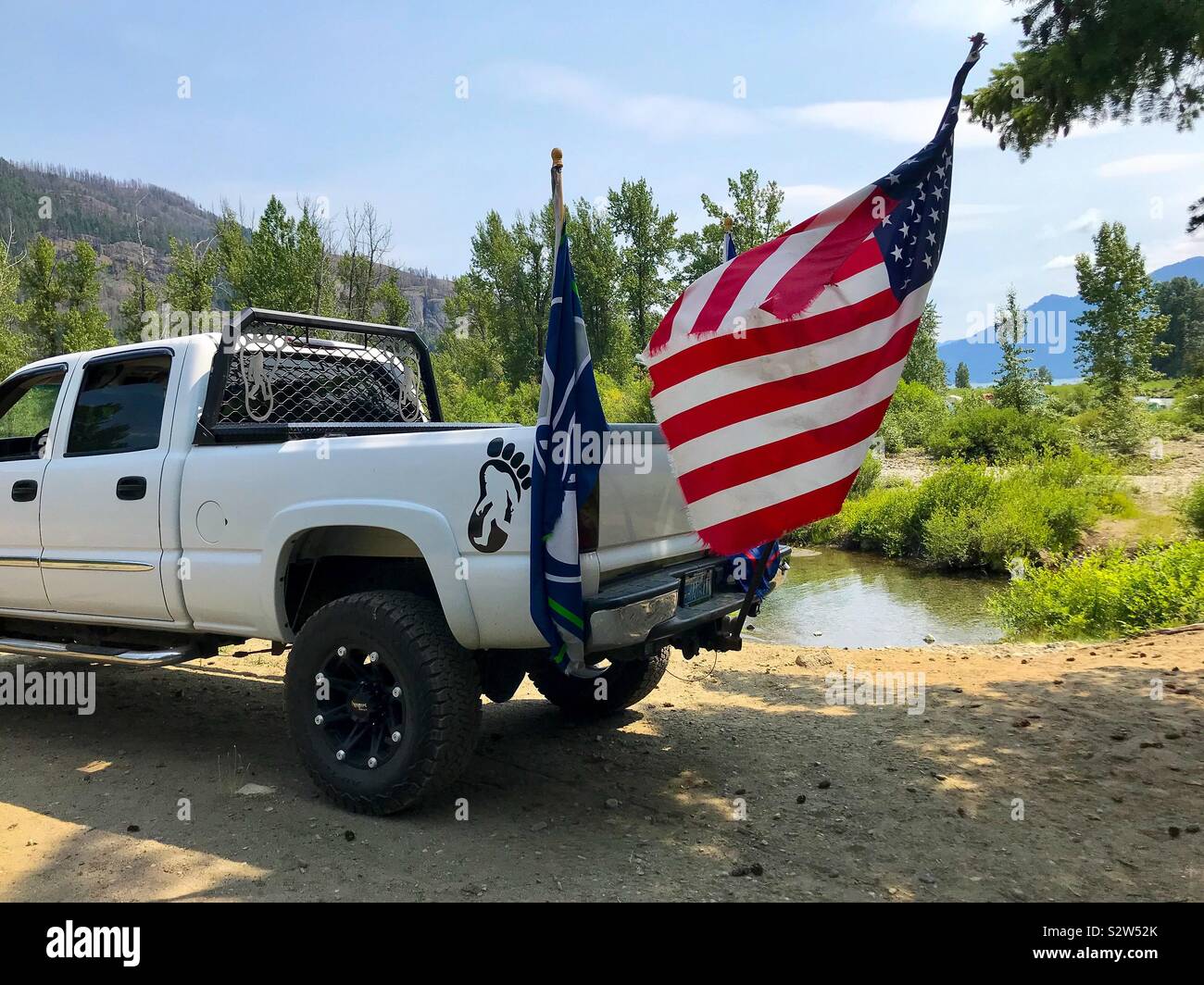 Vivid colors of United States flag on pickup with Bigfoot logo- July 4 - Smartphone Captured Stock Image