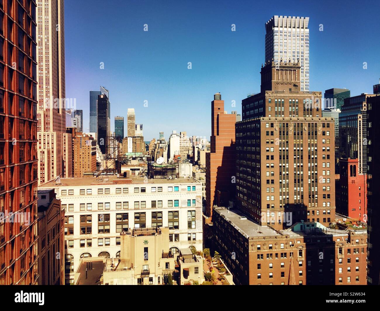 View of Midtown Manhattan skyscrapers from a roof deck in Murray Hill, NYC, USA - Smartphone Captured Stock Image