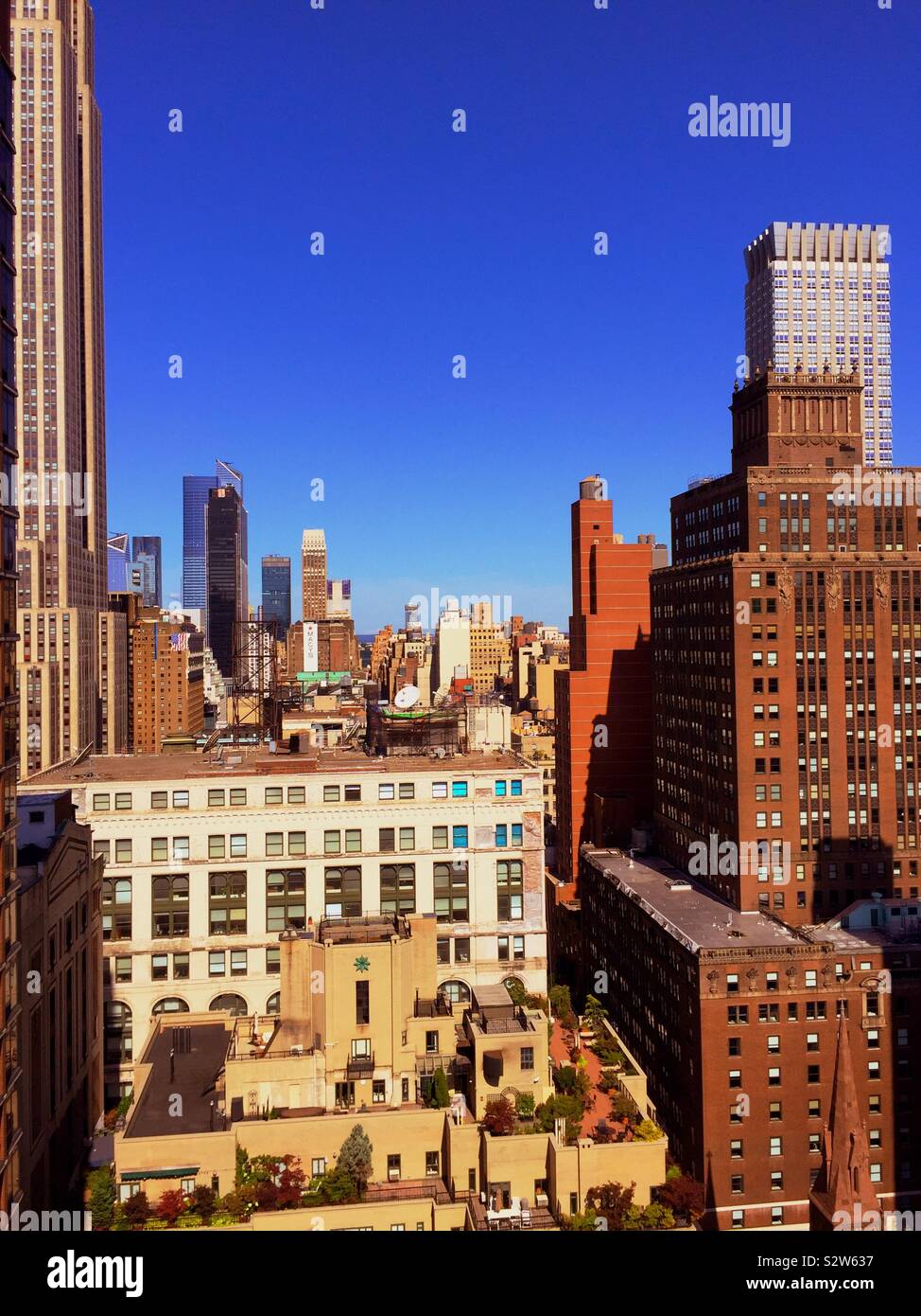 View of Midtown Manhattan skyscrapers from a roof deck in Murray Hill, NYC, USA - Smartphone Captured Stock Image