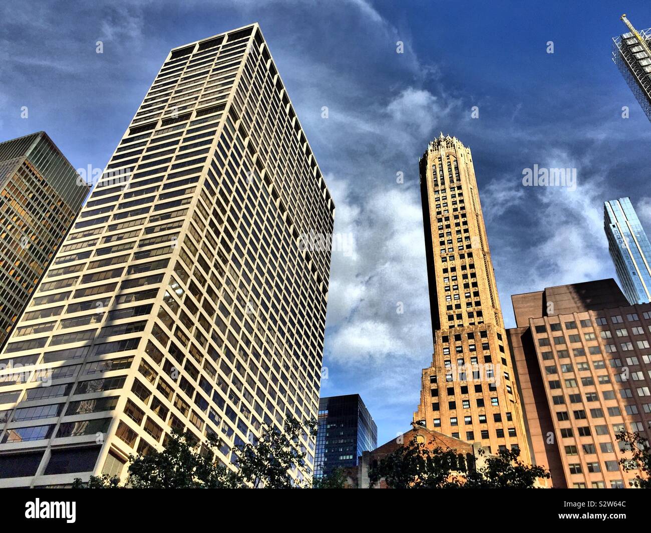 Tall skyscrapers line Park Avenue and Lexington Avenue, including the iconic general electric building, NYC, USA - Smartphone Captured Stock Image