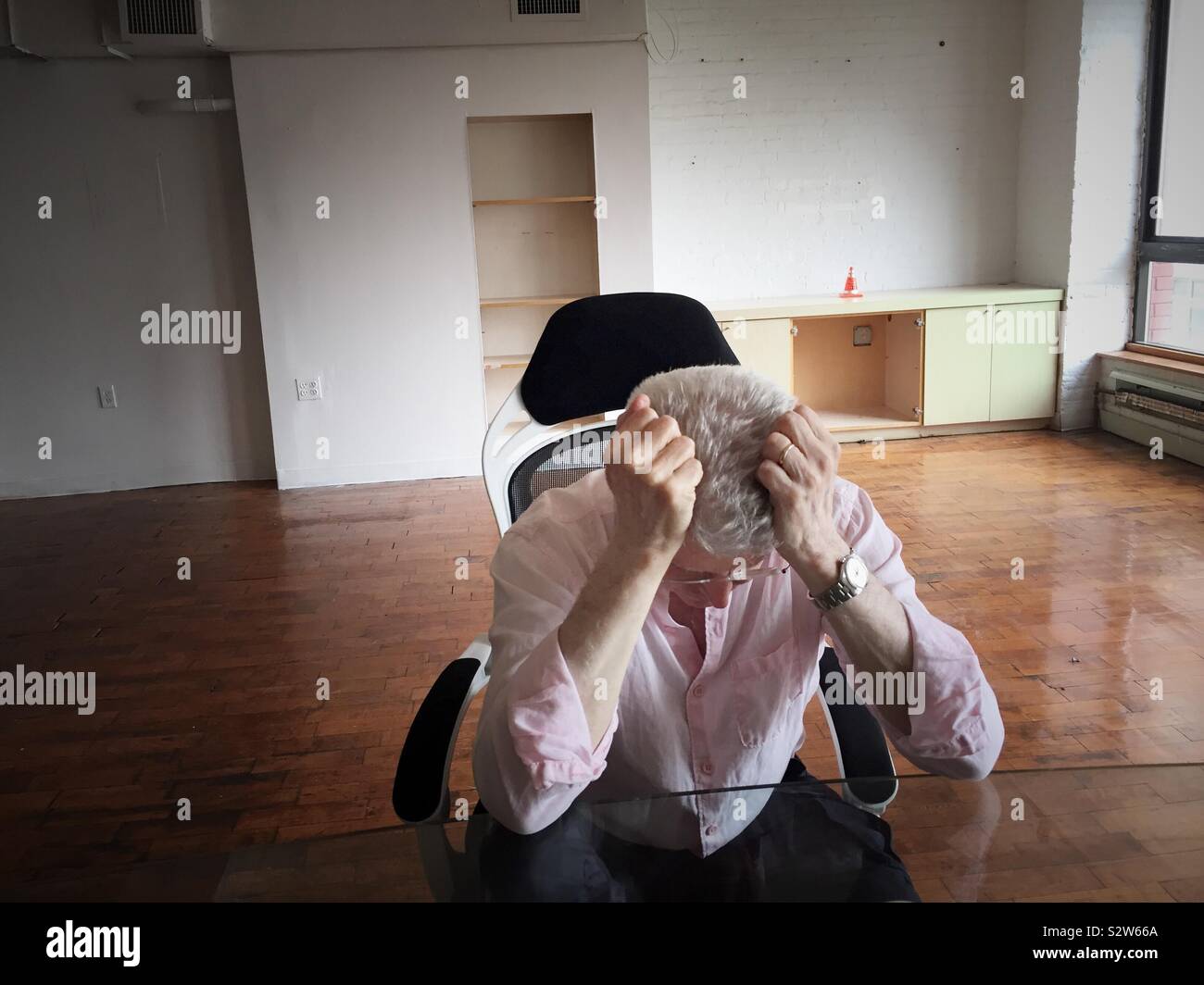 Depressed ruined senior man whose furniture has been repossessed is