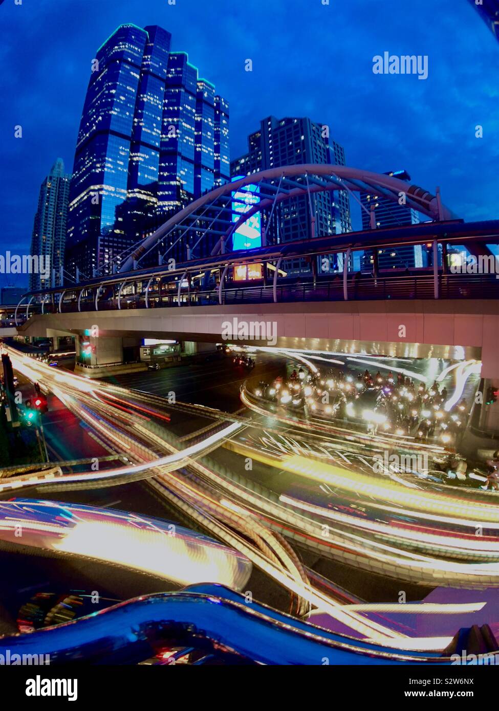 City junction and bridge, evening light trails - Smartphone Captured Stock Image