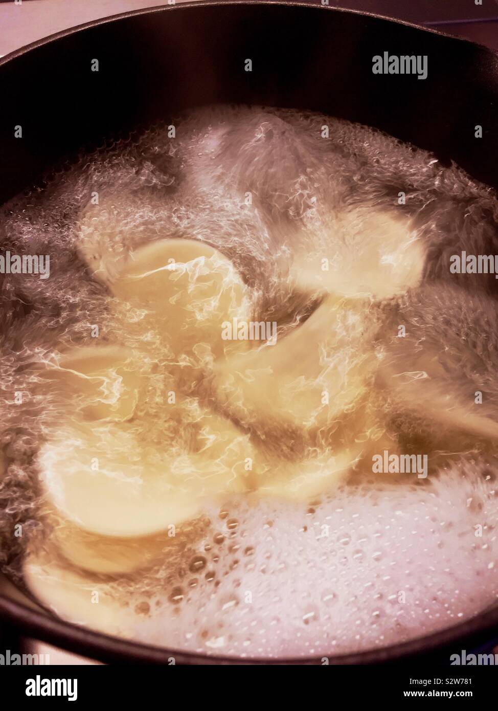 Croxetti Pasta being boiled on the stove top - Smartphone Captured Stock Image