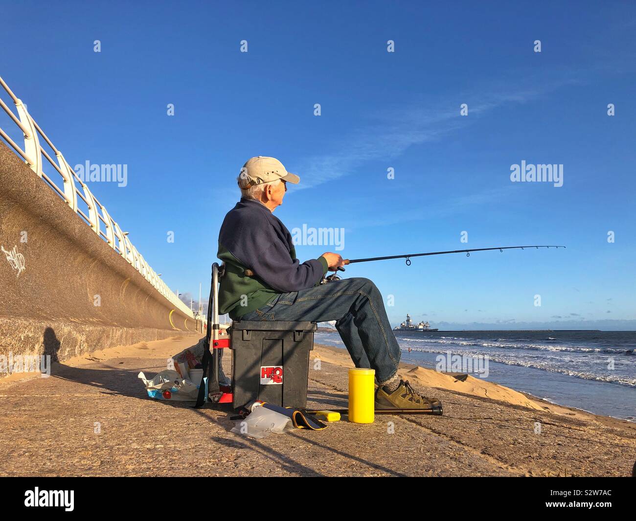 Fishing rods on the rock against sea background. Outdoor sport/gear concept  Stock Photo - Alamy