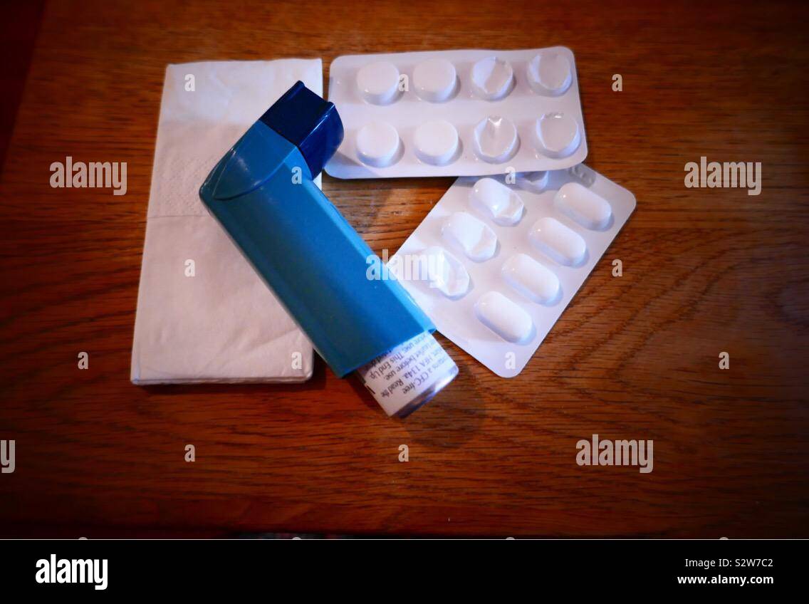 Asthma inhaler with tissues, medication and allergy tablets. Ready for