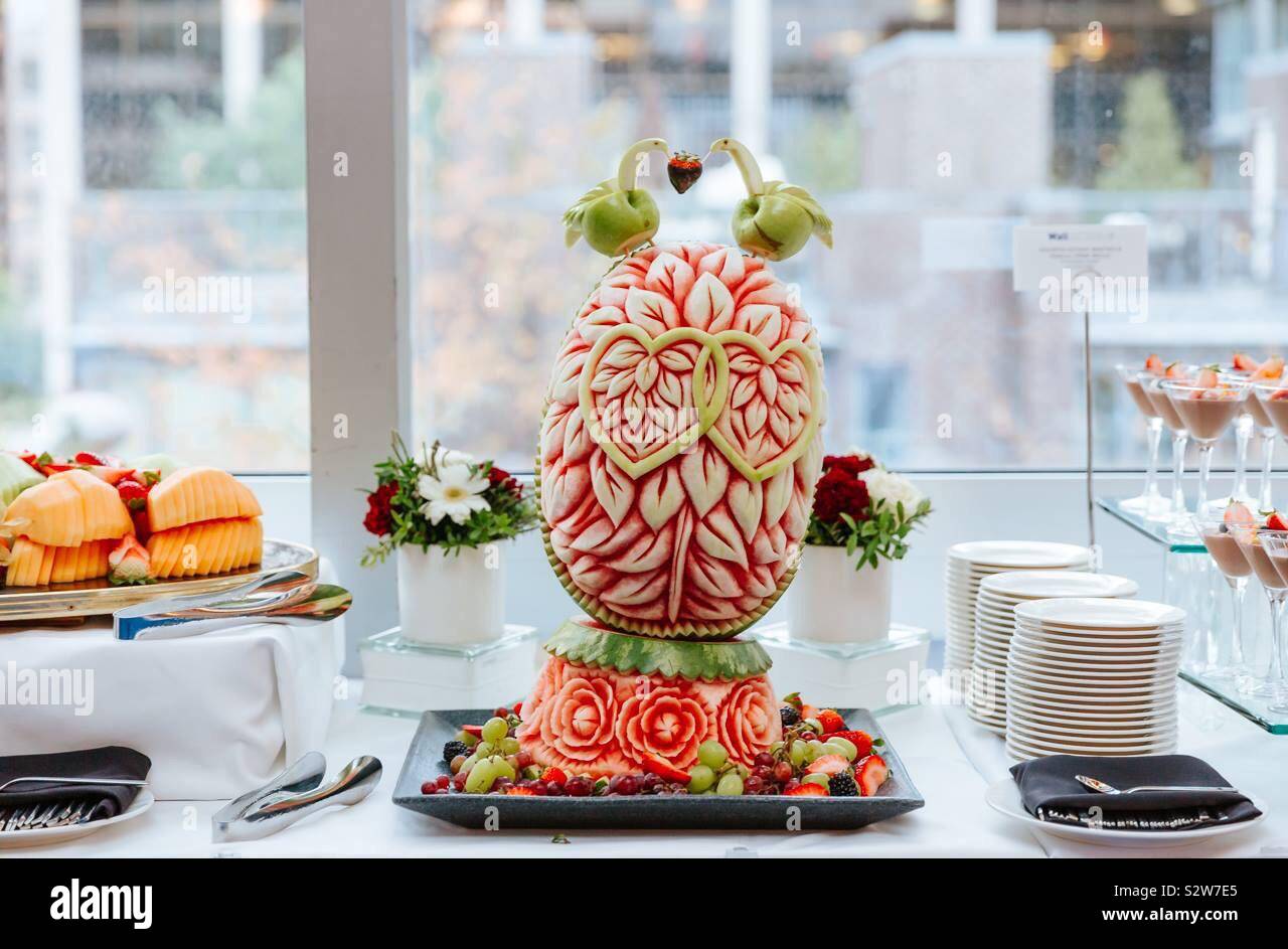 Fruit centrepiece on a dessert and fruits table. Fruit art Stock Photo