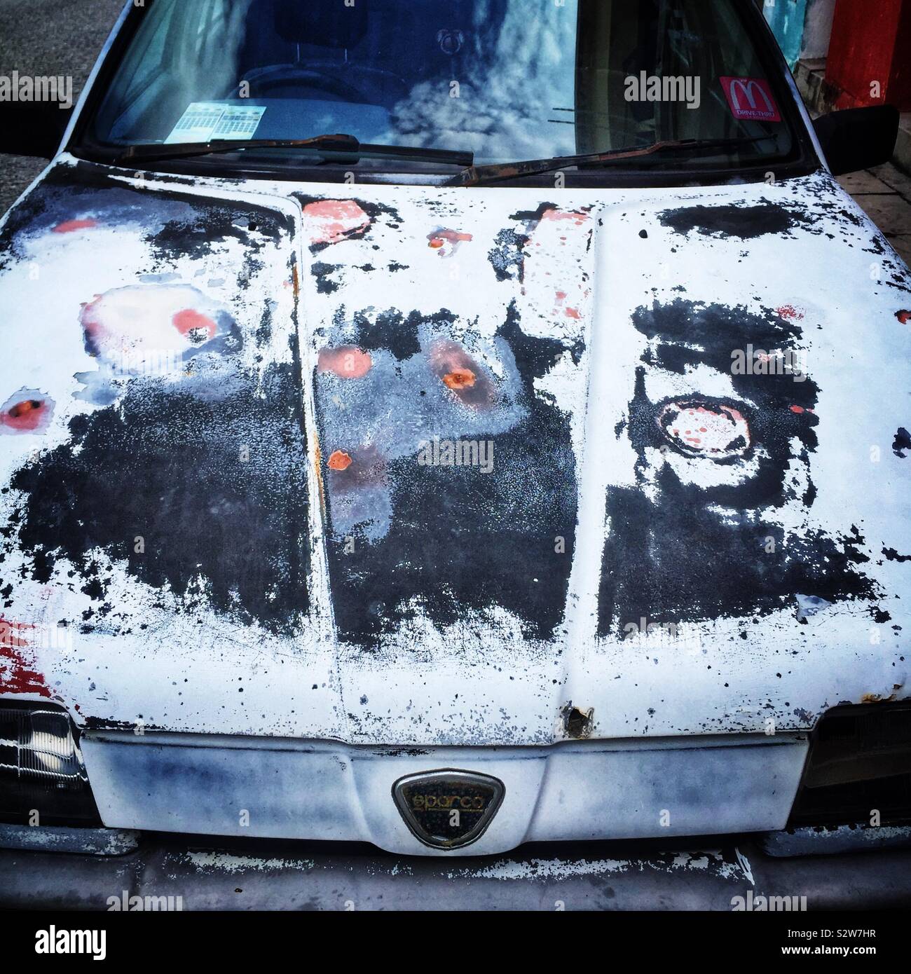 A rusted car, still registered and being driven, Lumut, Perak, Malaysia - Smartphone Captured Stock Image