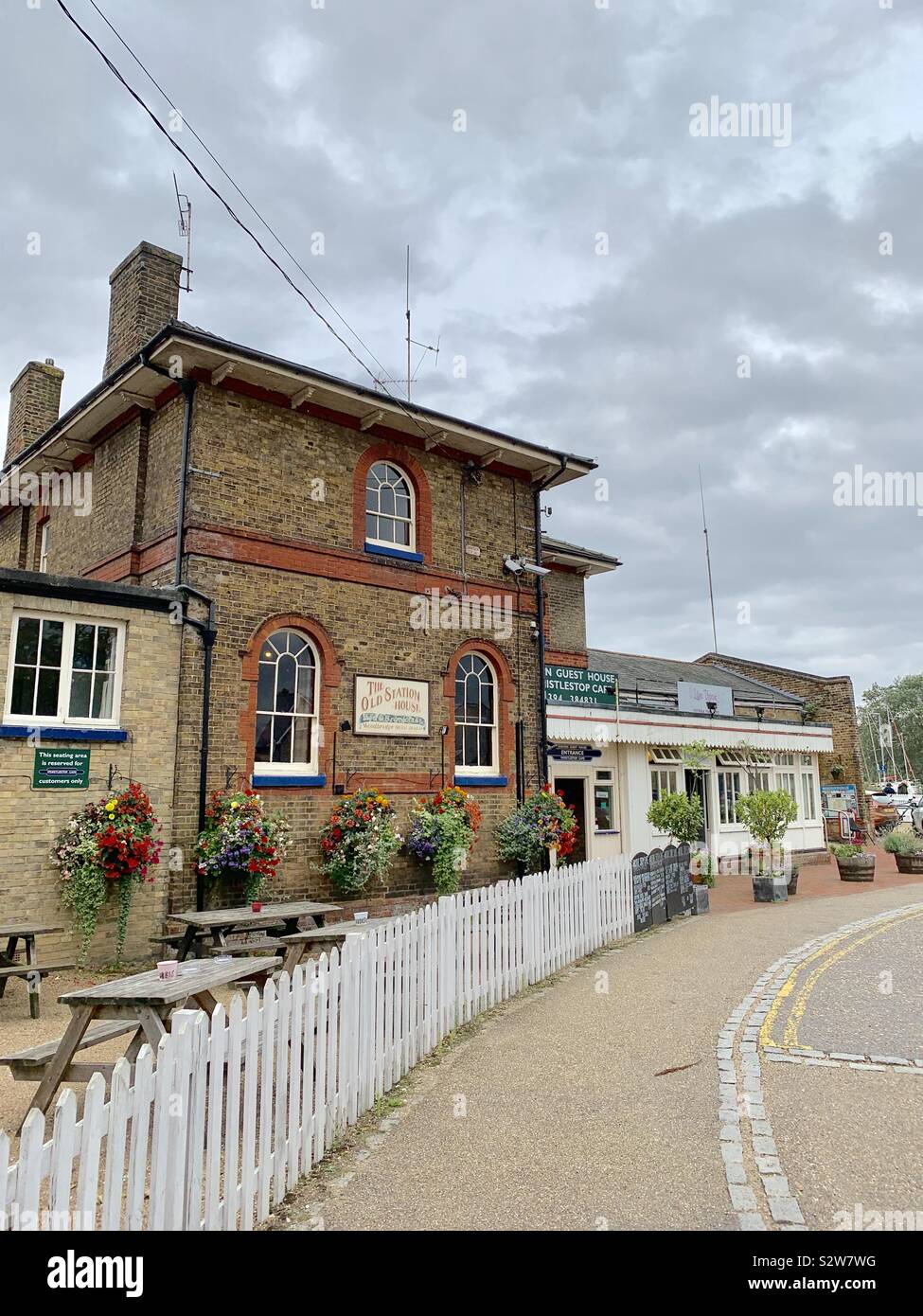 Woodbridge, UK - 16 August 2019: Station House hotel and the Whistlestop cafe beside the train station. - Smartphone Captured Stock Image