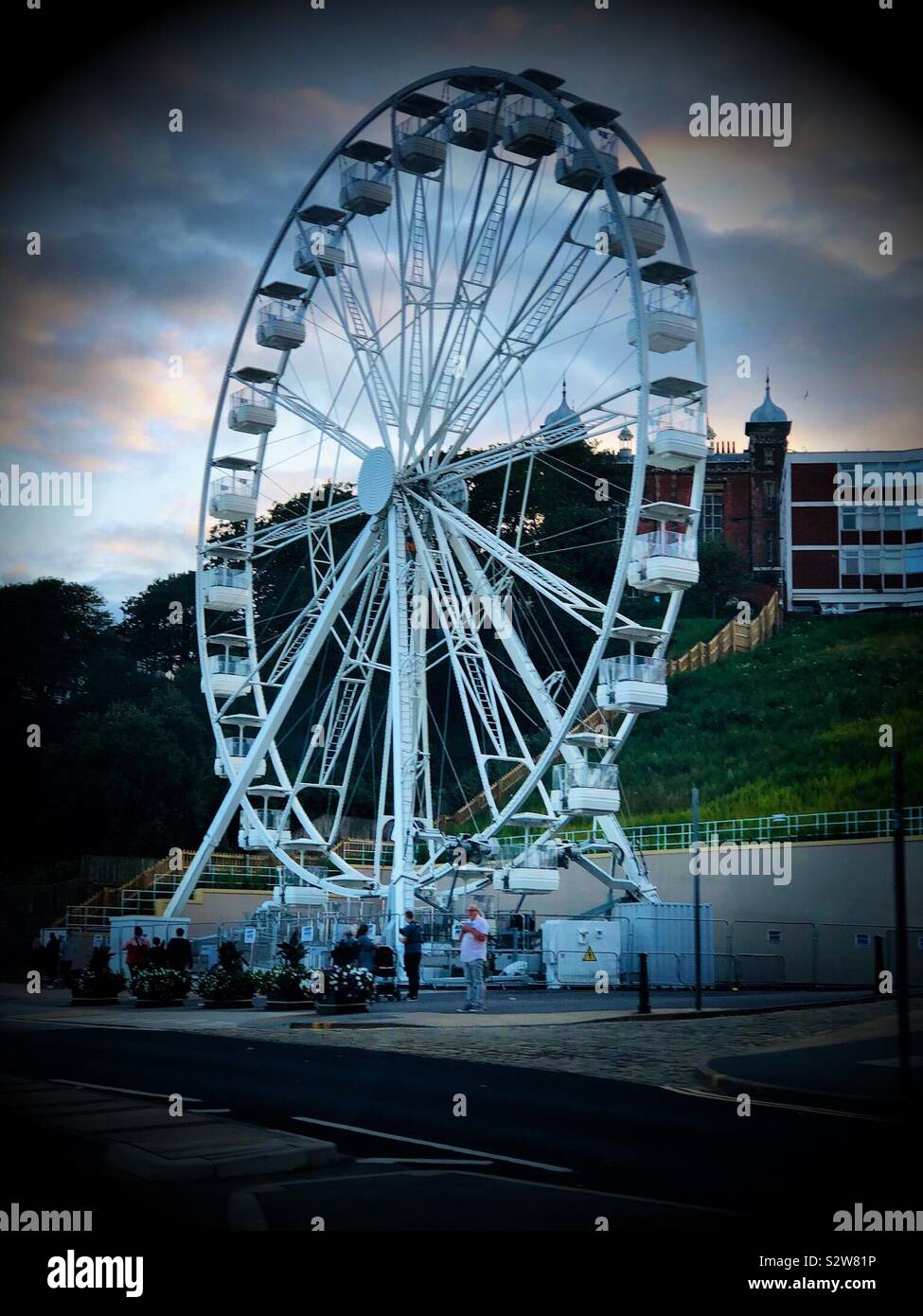 The temporary observation wheel located on the seafront at Scarborough, UK. - Smartphone Captured Stock Image