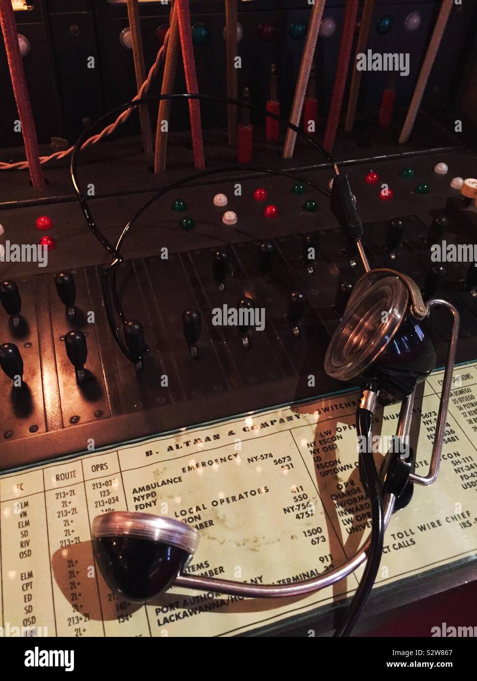 Vintage 1950s operator headset at a manual switchboard, USA - Smartphone Captured Stock Image