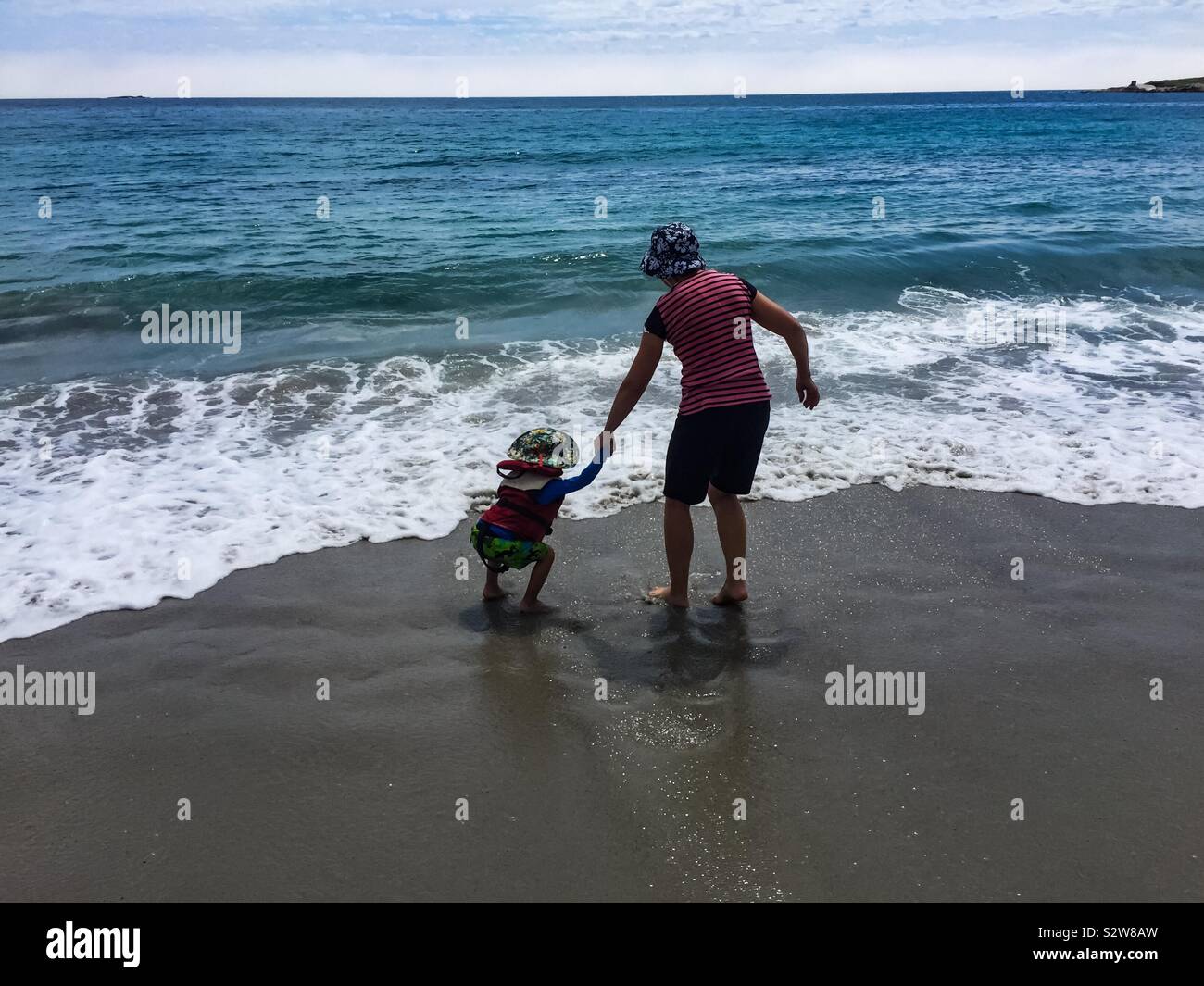 Old and Young amid the waves - Smartphone Captured Stock Image