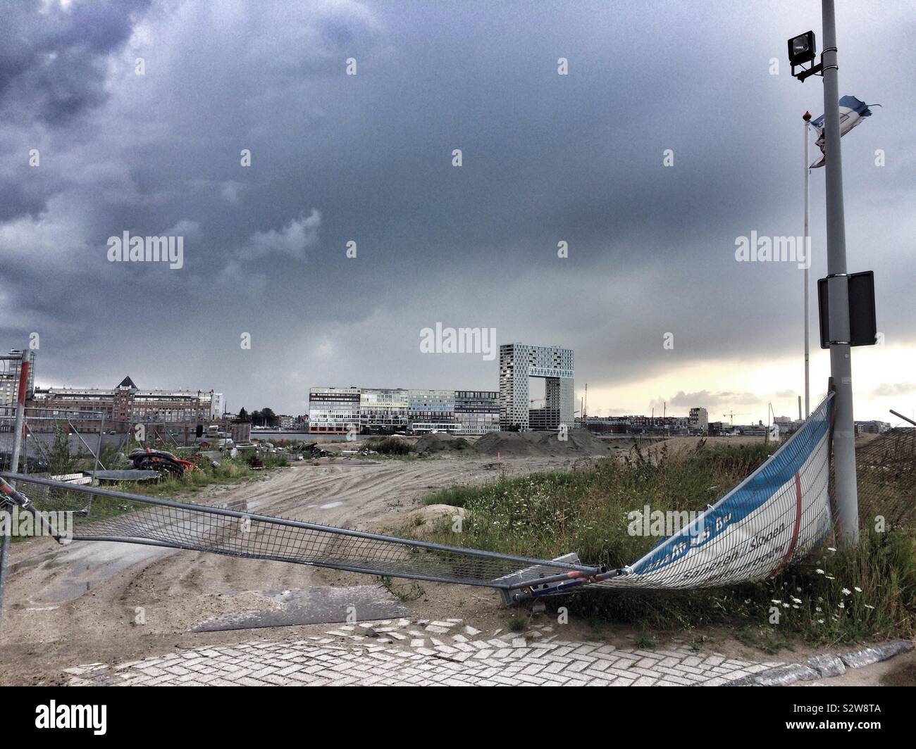 The Pontsteiger building, Amsterdam, seen from the other side of the water on desolate waste ground - Smartphone Captured Stock Image
