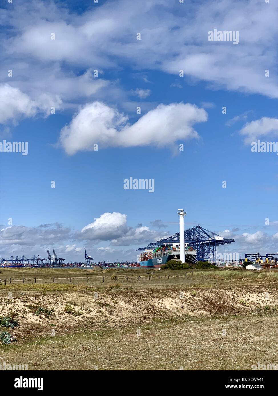 Felixstowe, Suffolk, UK - 18 August 2019: The port seen from across the nature reserve at Landguard Point. - Smartphone Captured Stock Image