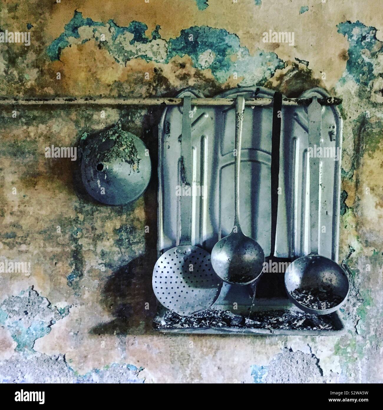 Kitchen utensils in abandoned house Italy Stock Photo