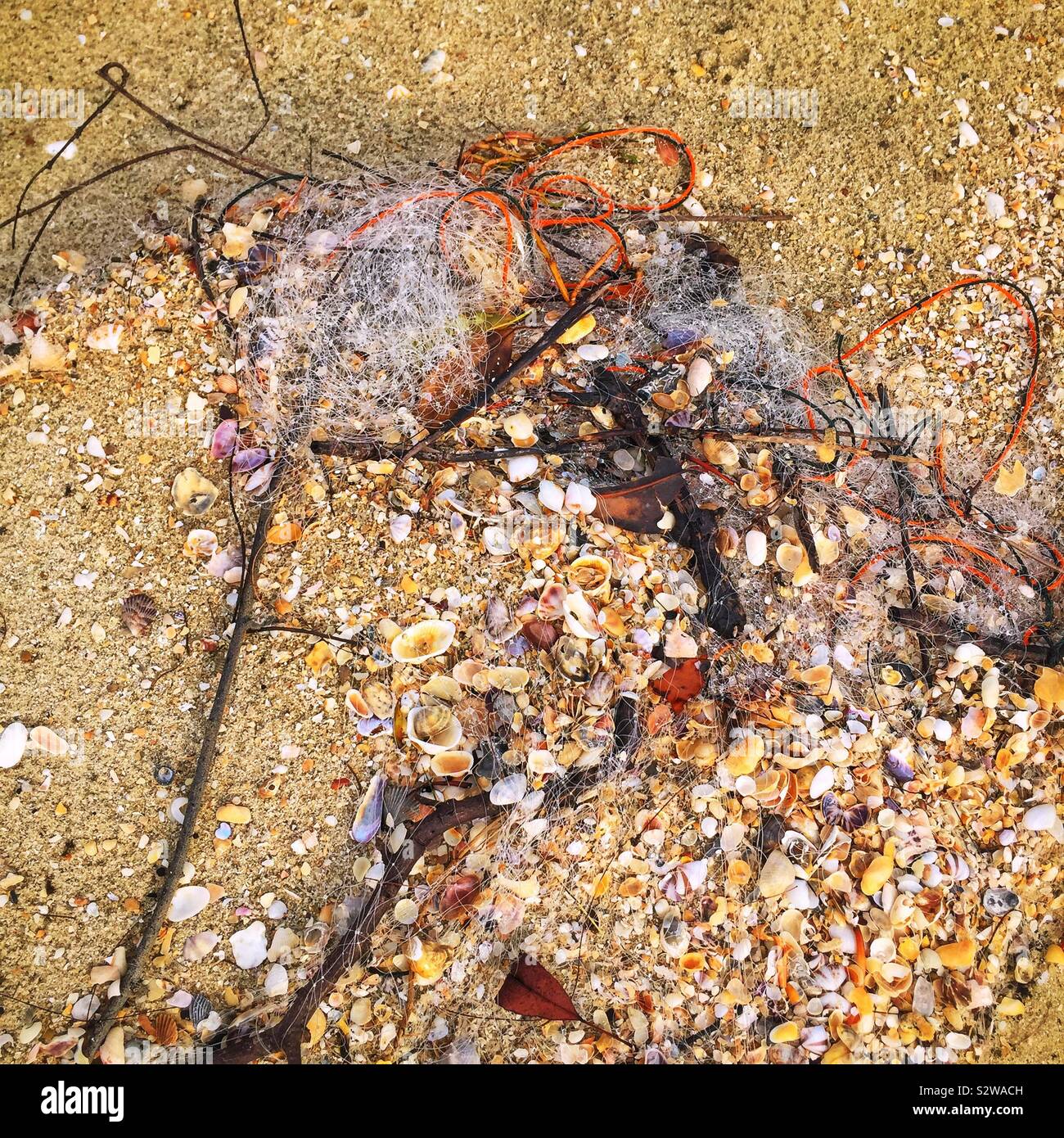 Fishing net washed ashore on the beach, Manjung River estuary, near Lumut, Perak, Malaysia - Smartphone Captured Stock Image