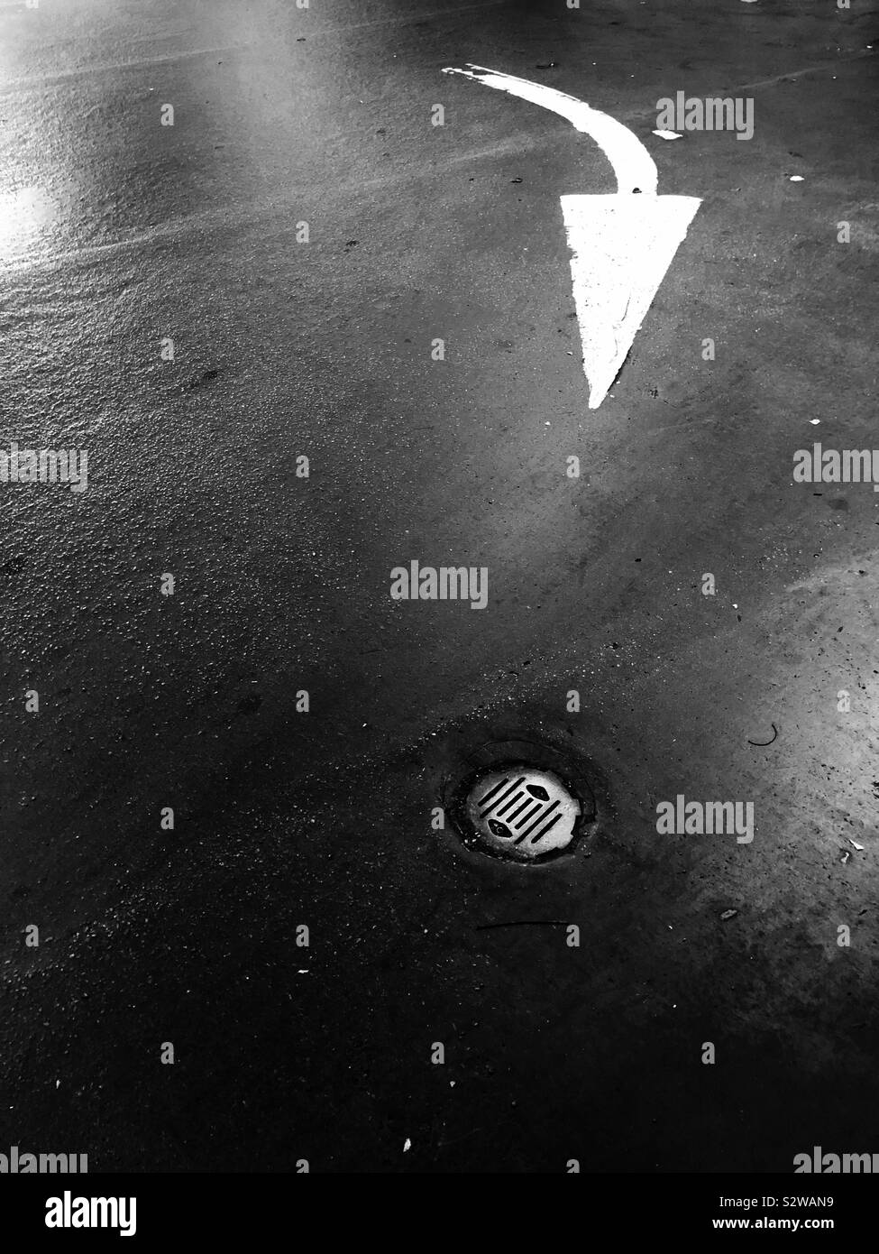 Directional arrow on road - Smartphone Captured Stock Image