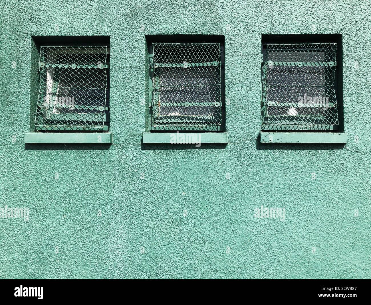 Three windows with security grille - Smartphone Captured Stock Image