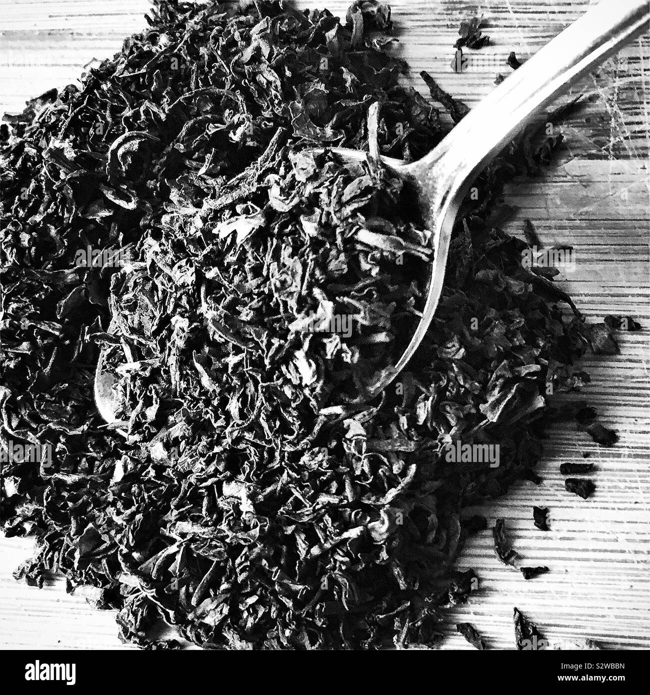 Tea leaves with teaspoon Stock Photo Alamy