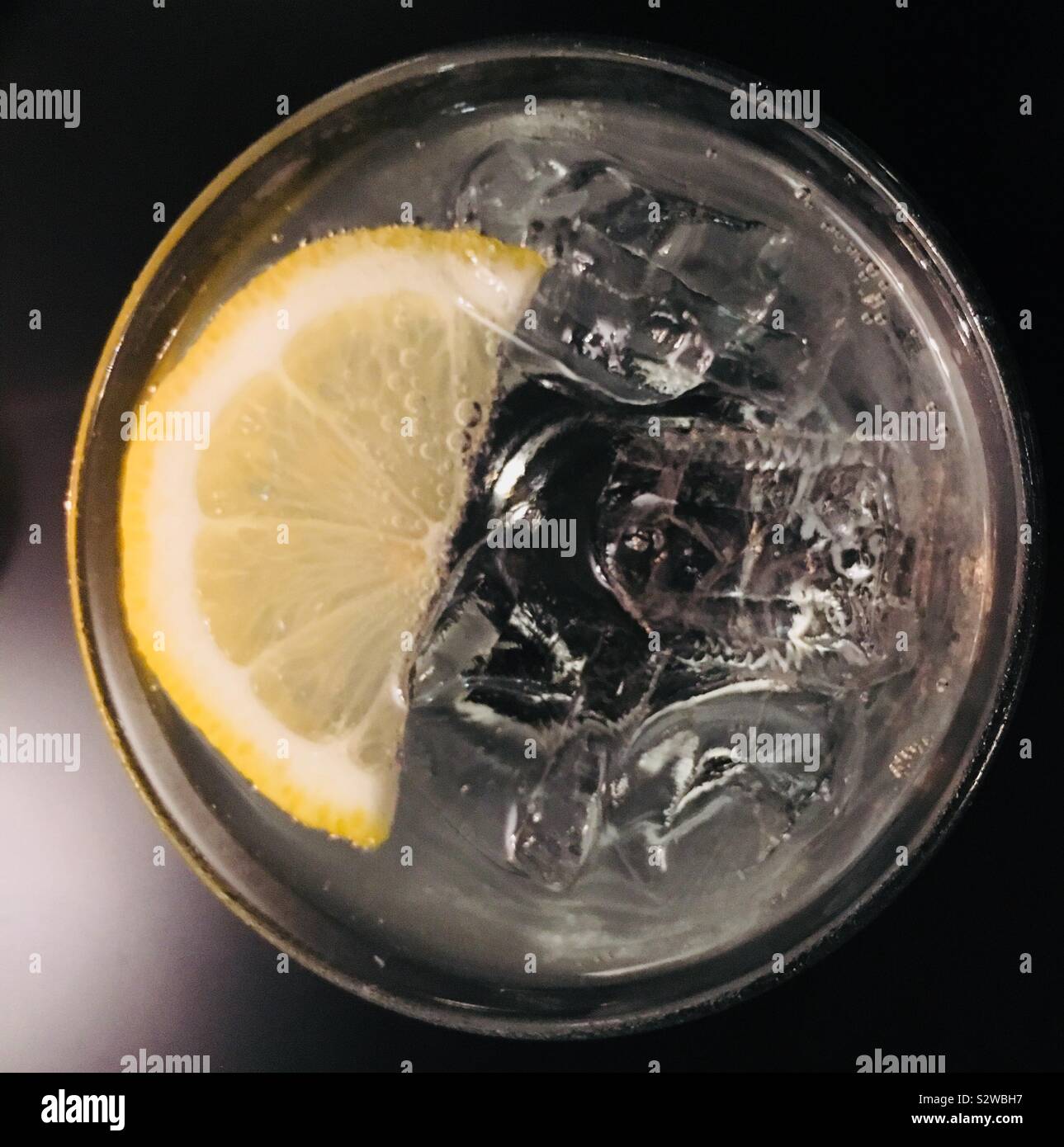 Gin and Tonic with ice and a slice of lemon. Summer drink. Gin