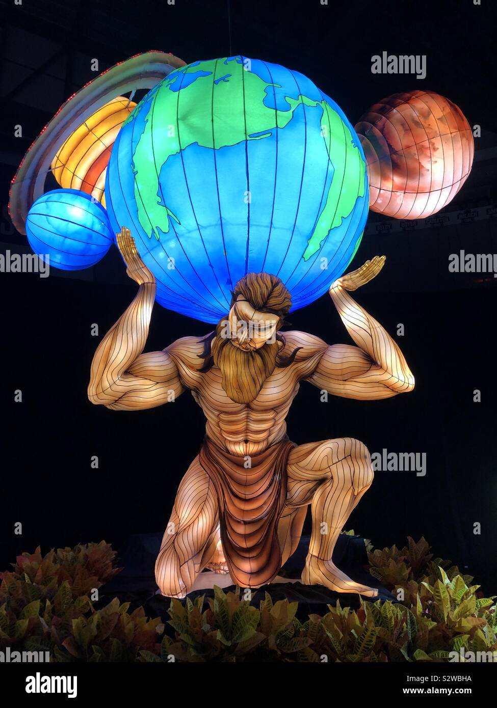 Atlas holding the World, indoor lantern display. - Smartphone Captured Stock Image