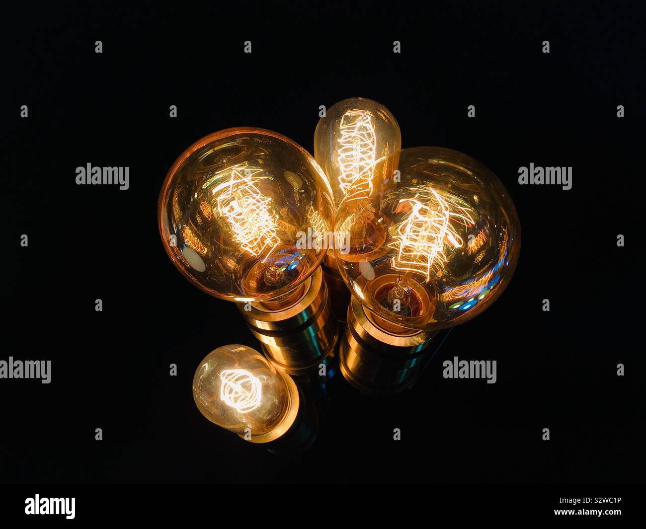 Illuminated vintage style lightbulbs Stock Photo