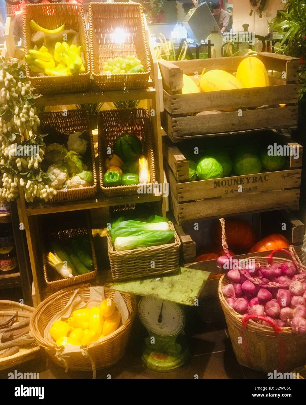 Colourful display of artificial plastic vegetables, fruits and condiments on a shelf outside a Chinese restaurant - Reading, United Kingdom Stock Photo