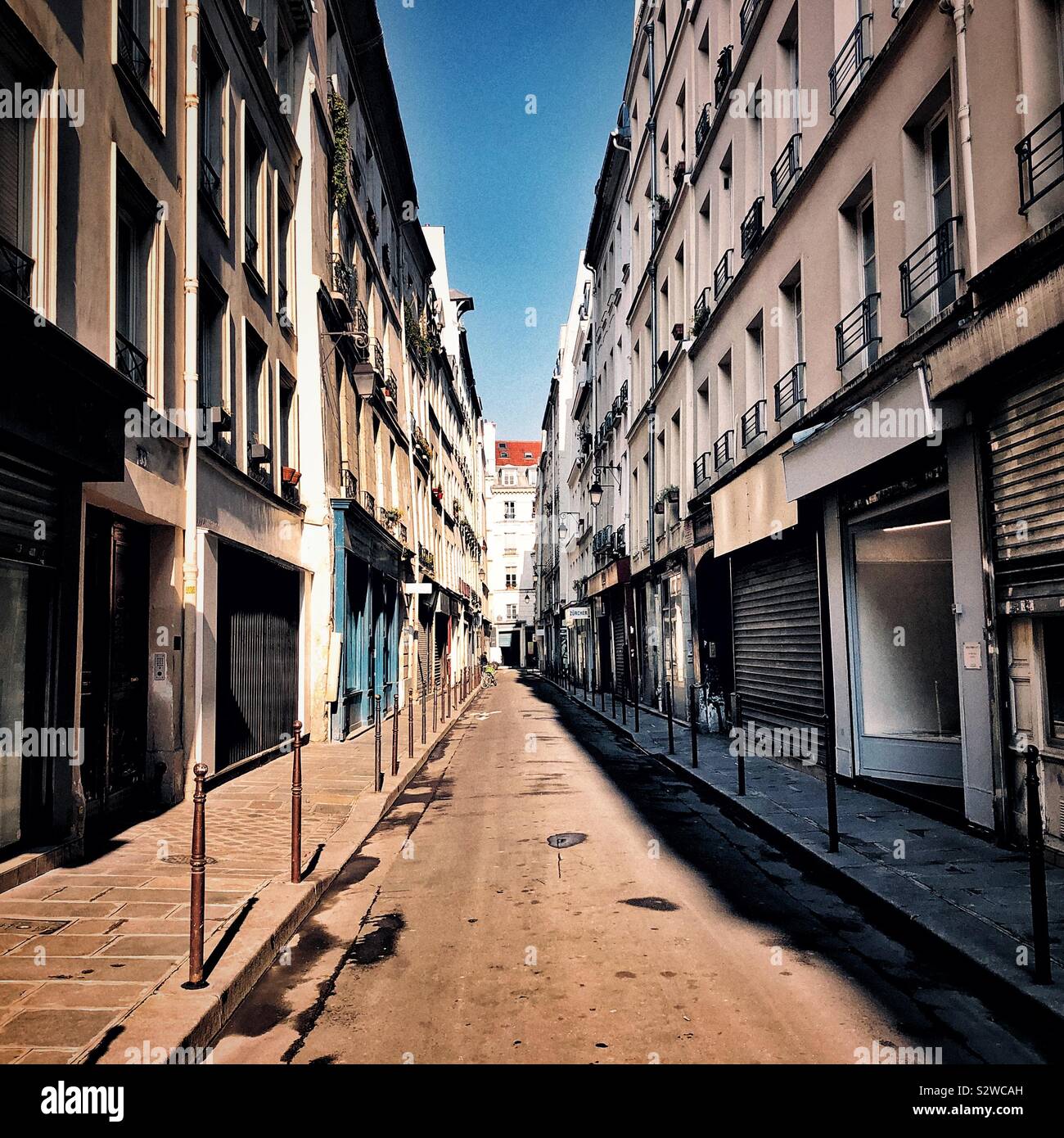 Sunny day on Paris street in Marais neighborhood Stock Photo