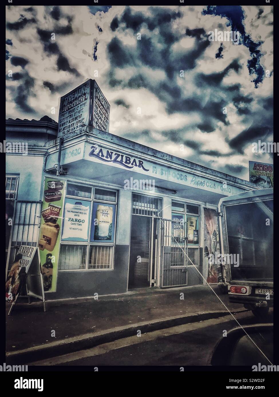 Barber shop seen from car window,Maitland, Cape Town, South Africa. Extreme use of filters. - Smartphone Captured Stock Image