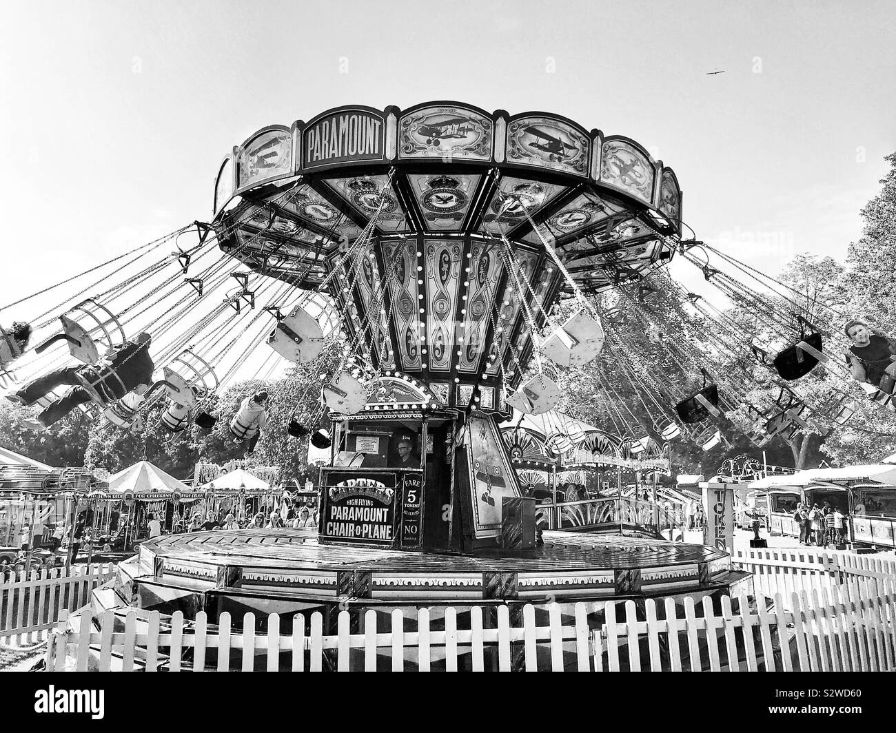Fairground merry go round swing, England Stock Photo Alamy