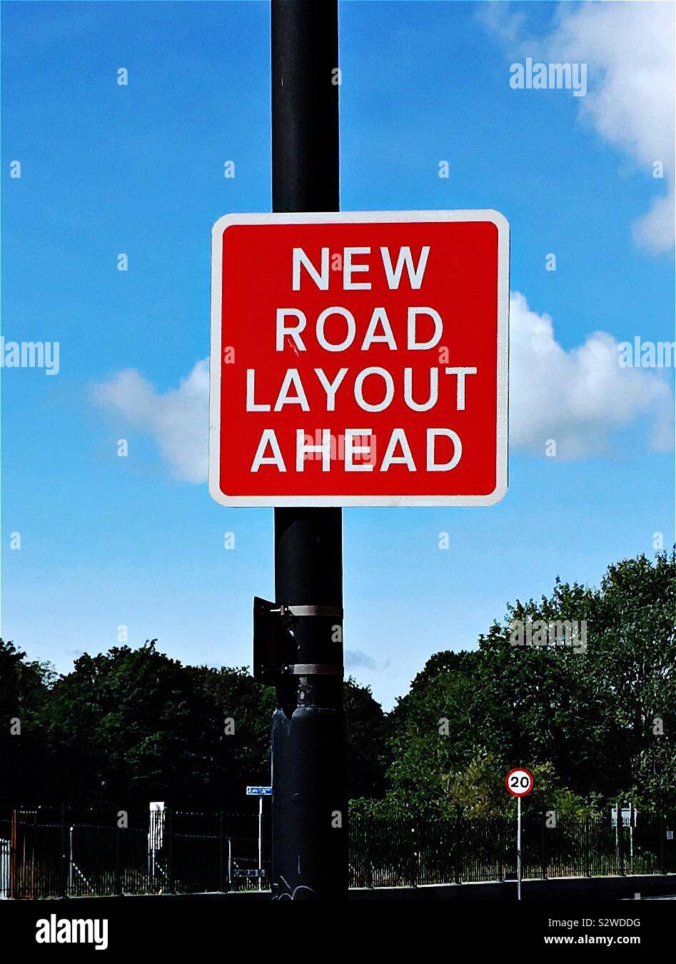 U.K. road sign in red and white, indicating a new road layout ahead. Stock Photo