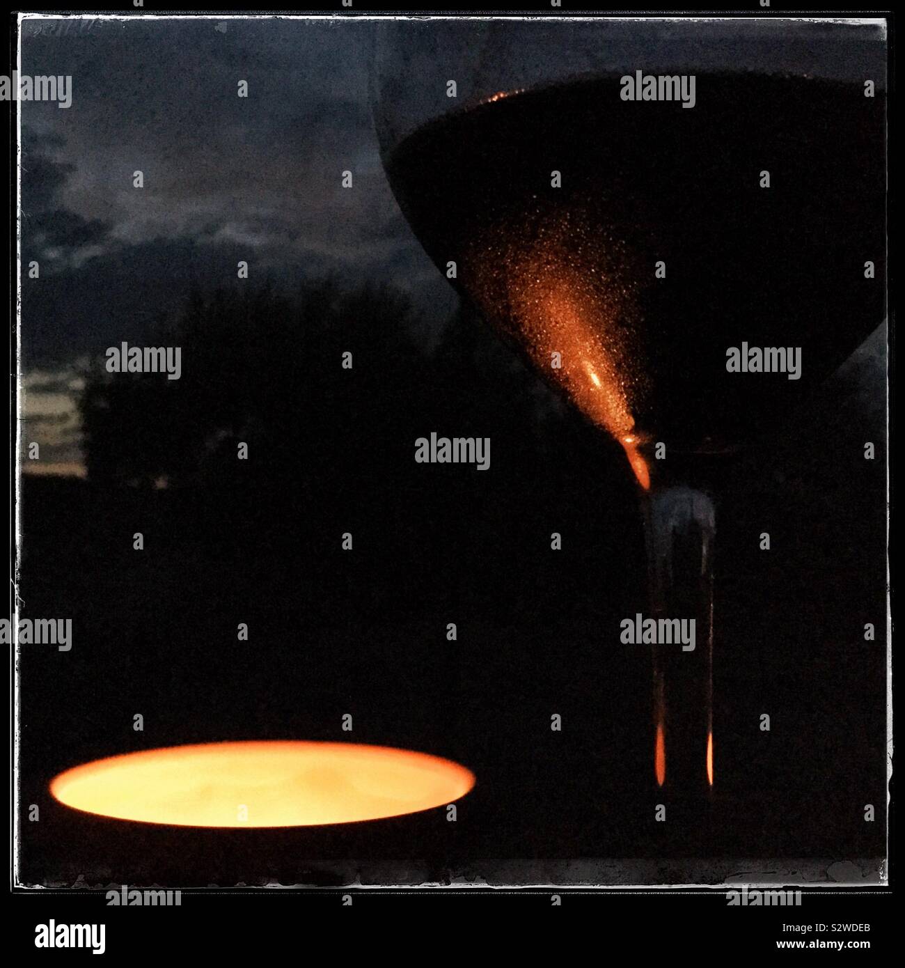 Red wine by candlelight, Catalonia, Spain. - Smartphone Captured Stock Image