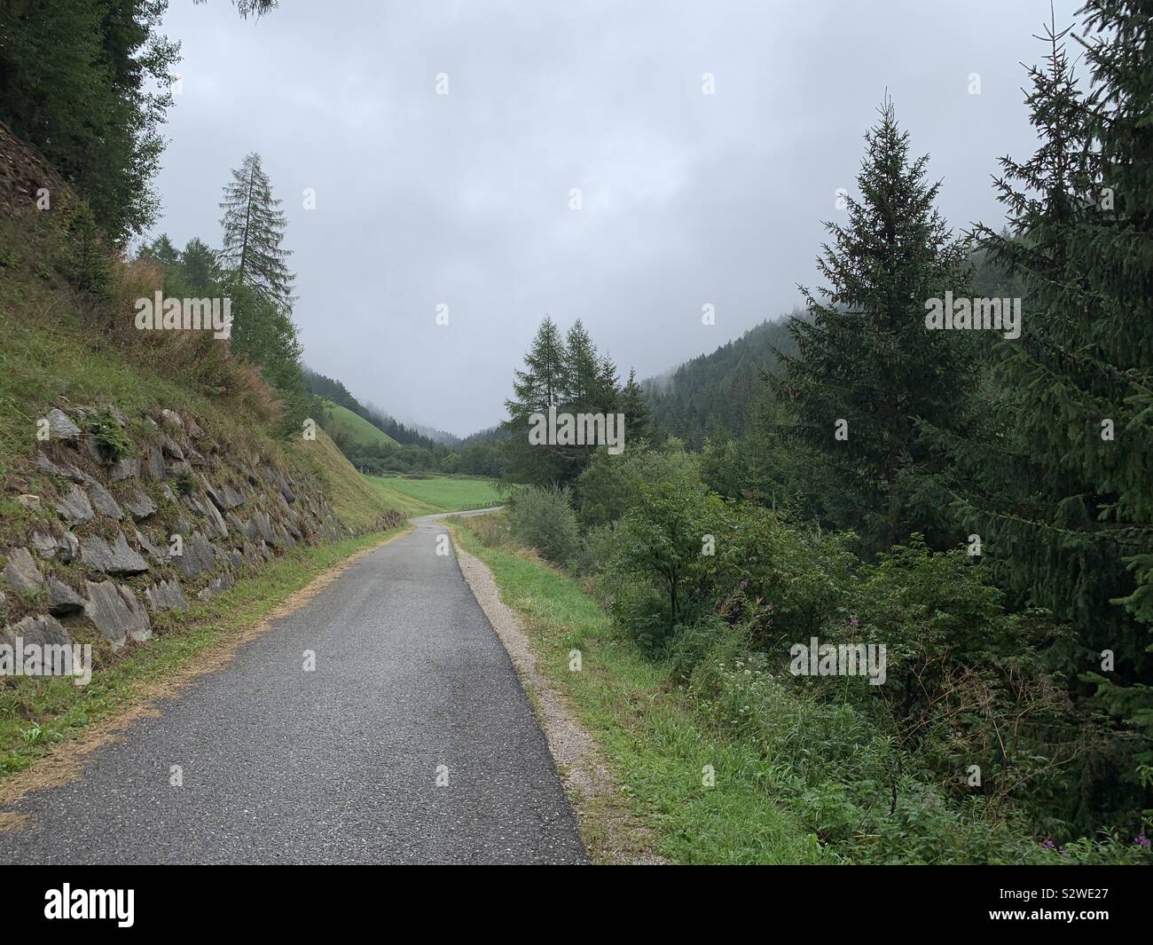 Mountain road on a cloudy summer day. - Smartphone Captured Stock Image