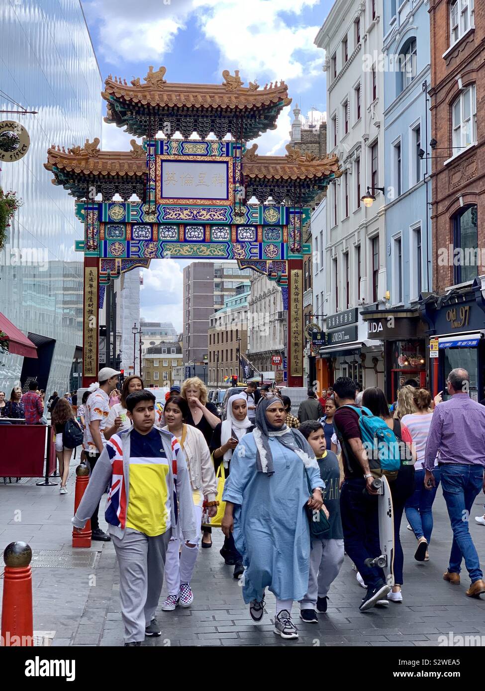 London, UK - 21 August 2019: People walking in Chinatown, west London. - Smartphone Captured Stock Image