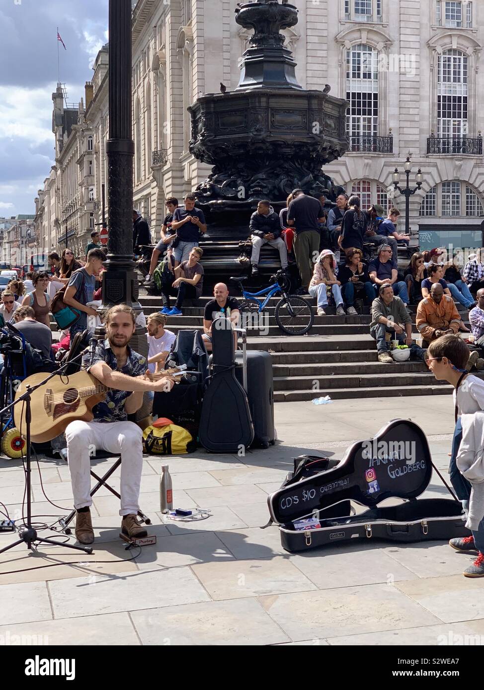 London, UK - 21 August 2019: Yannai Goldberg busking in Piccadilly circus. - Smartphone Captured Stock Image