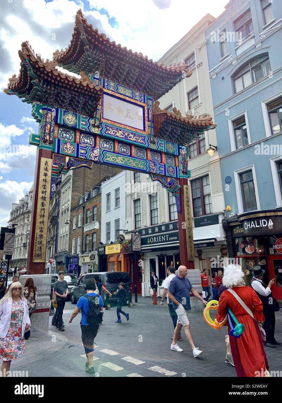London, UK - 21 August 2019: People walking in Chinatown, west end of London. - Smartphone Captured Stock Image