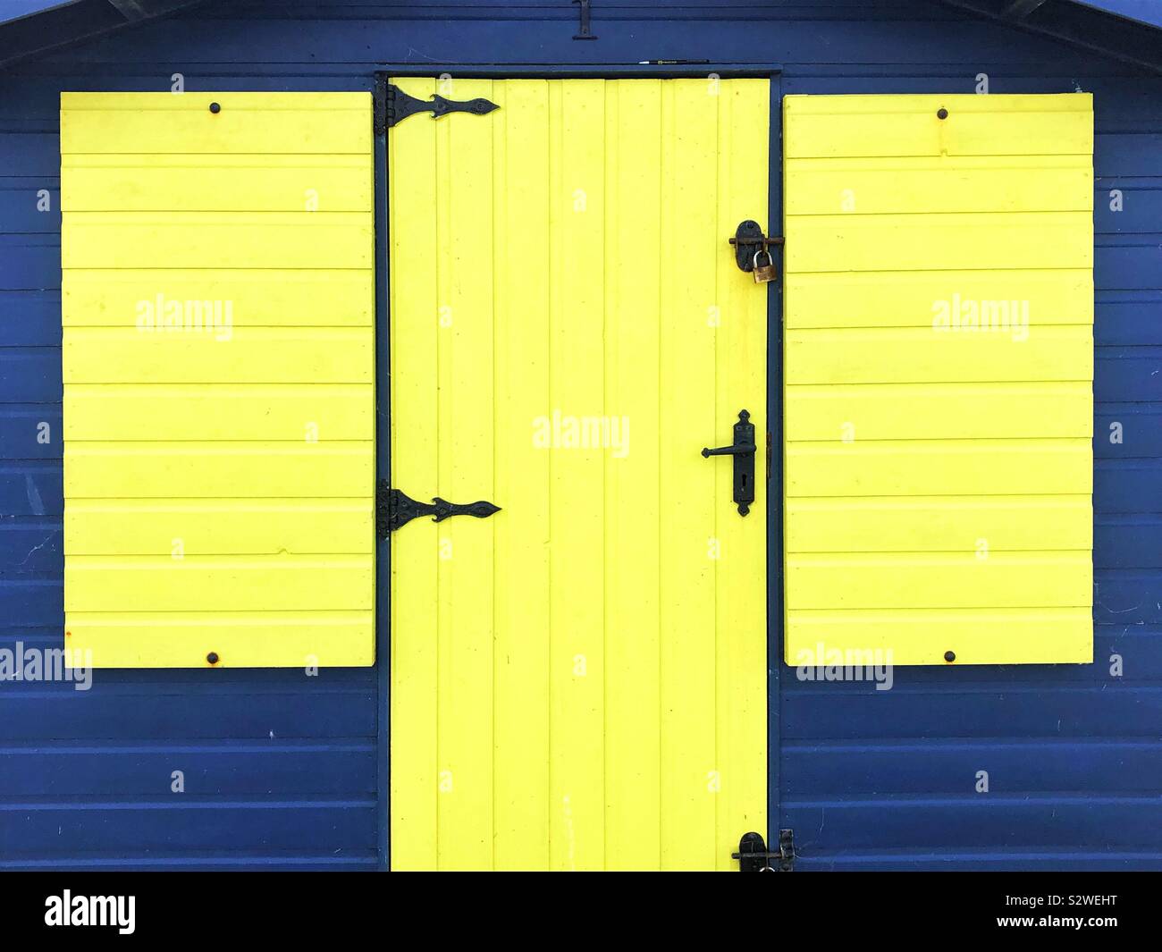 Yellow and blue beach hut, Westward Ho, Devon, England. - Smartphone Captured Stock Image