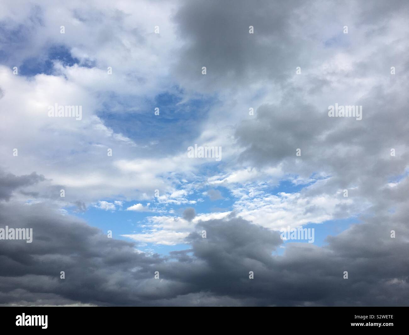 A patch of blue on a cloudy day Stock Photo