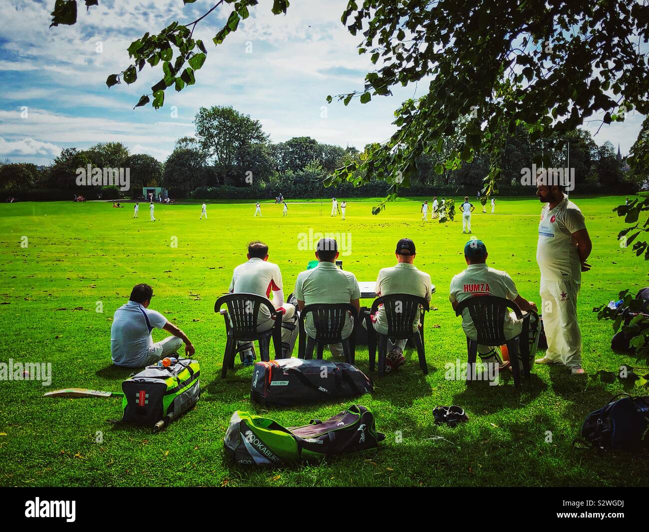 Cricket in the park Stock Photo