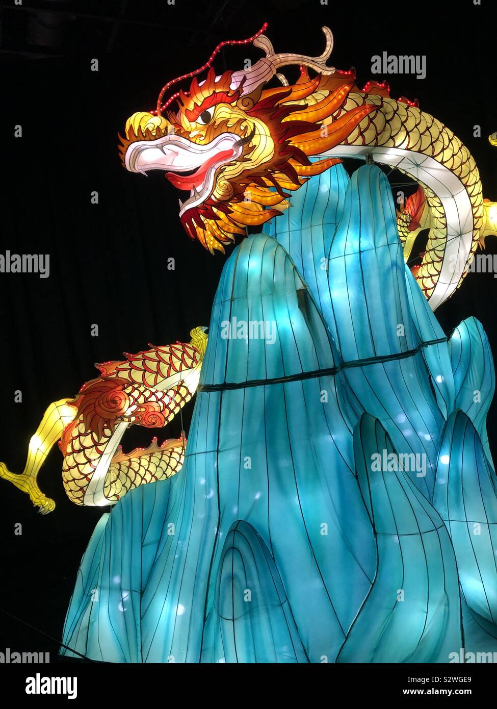 Lantern festival displaying a mythical dragon. - Smartphone Captured Stock Image
