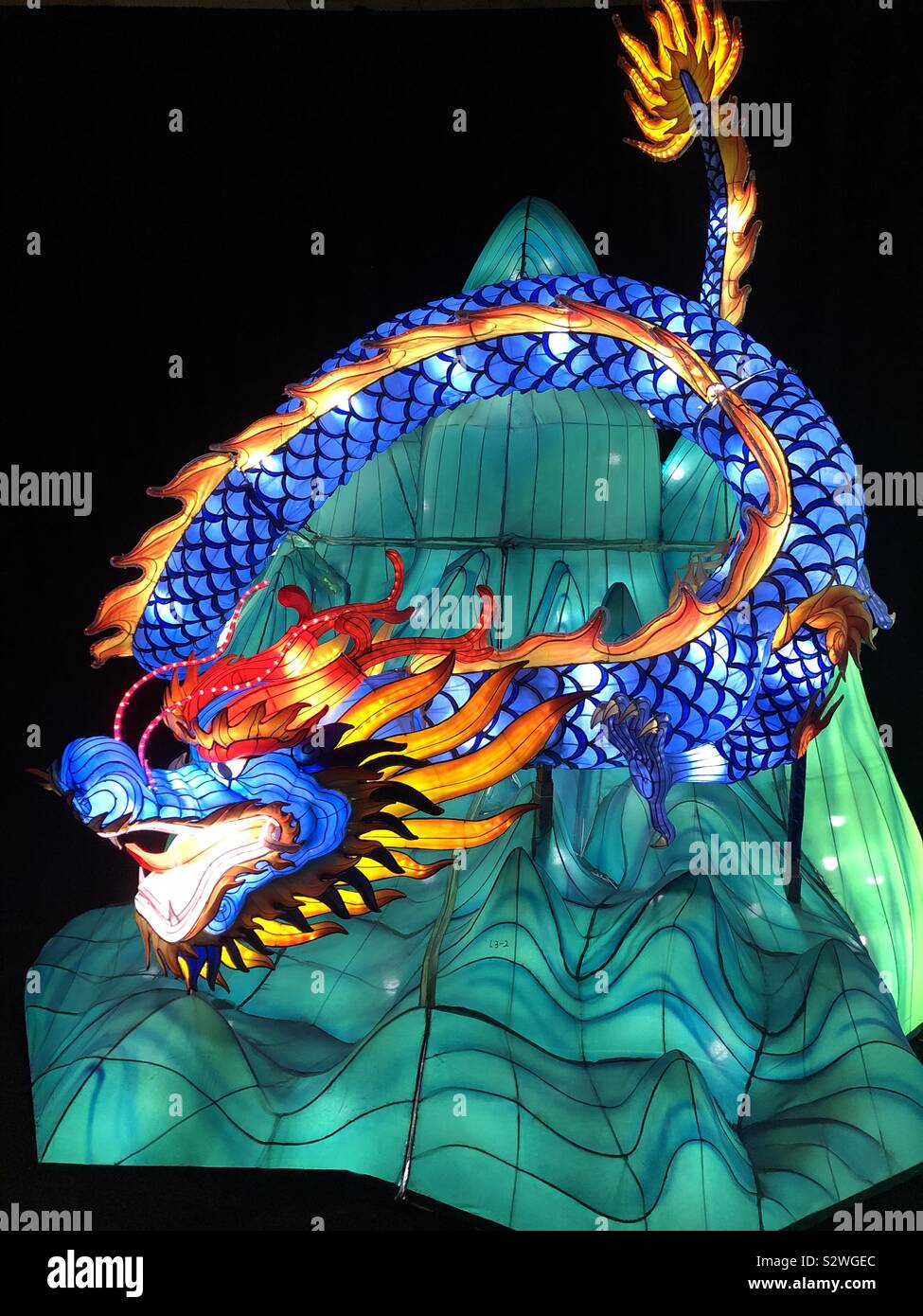 Sculpture of a mythical Chinese dragon at a lantern festival. - Smartphone Captured Stock Image