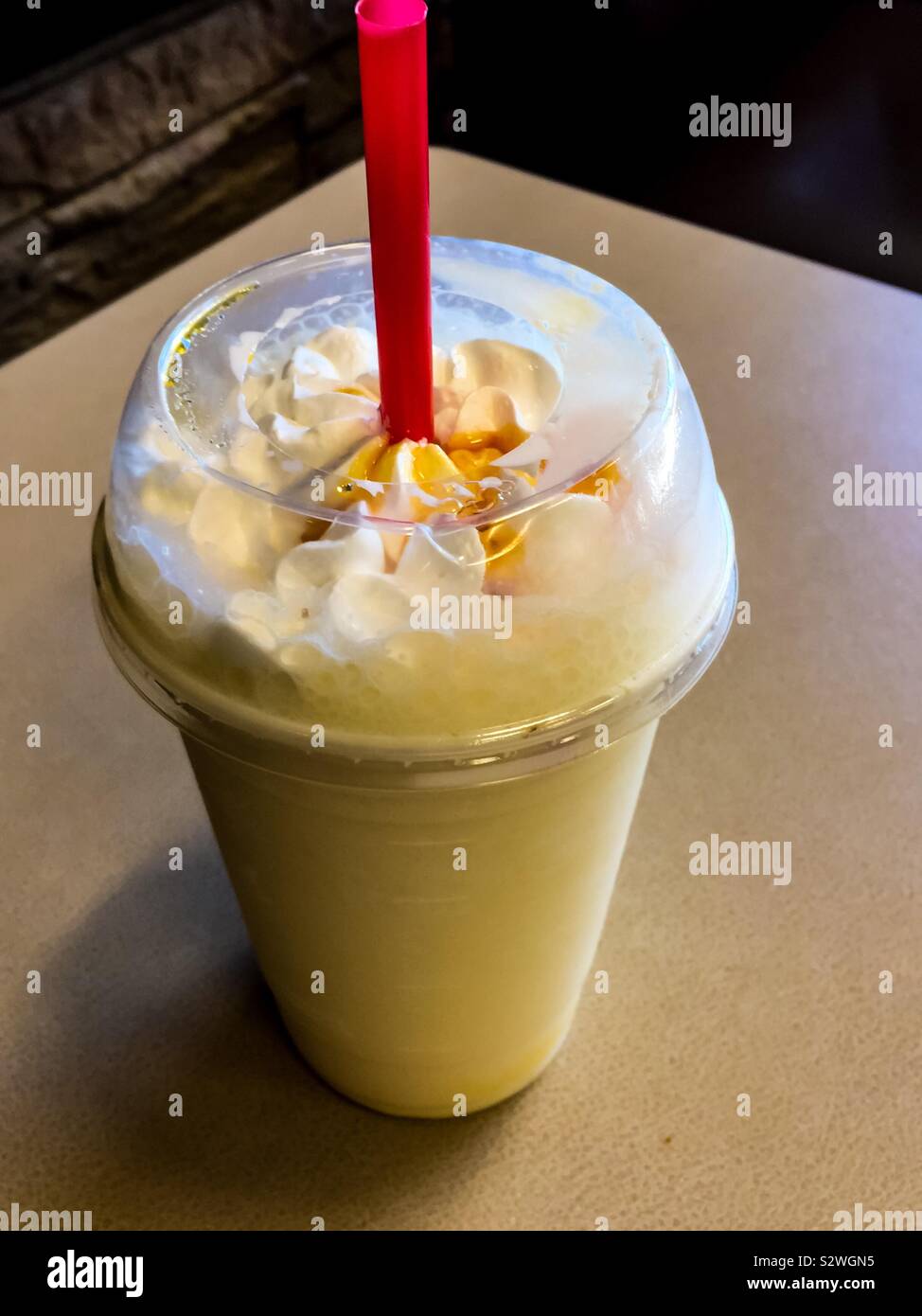 Decadent creamy drink. Single use plastics and over 500 calories. SUPs are being discontinued in many countries. - Smartphone Captured Stock Image