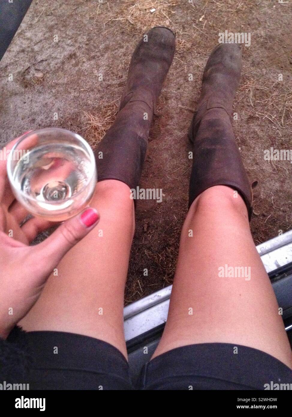 Relaxing with wine after a hard day’s work with the horses - Smartphone Captured Stock Image