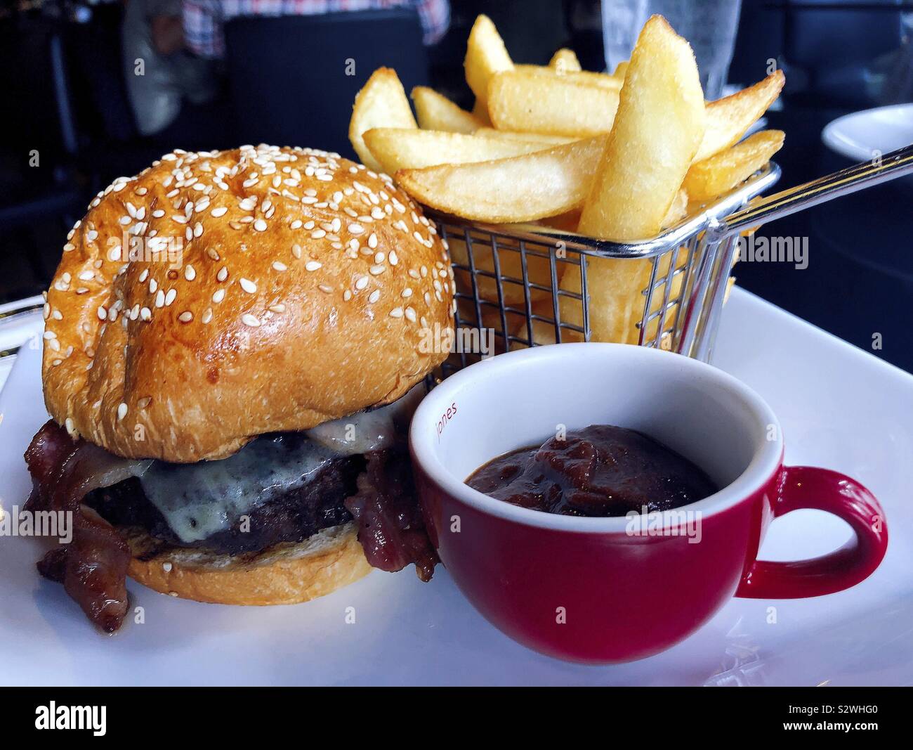 Cheeseburger Bacon cheese chips and tomato sauce - Smartphone Captured Stock Image